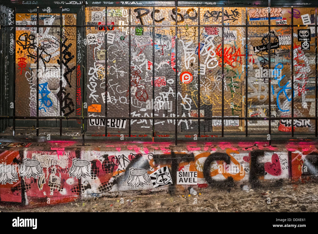 Stickers and Graffiti on Wall and Window of Building, Post Alley, Seattle, Washington Stock Photo