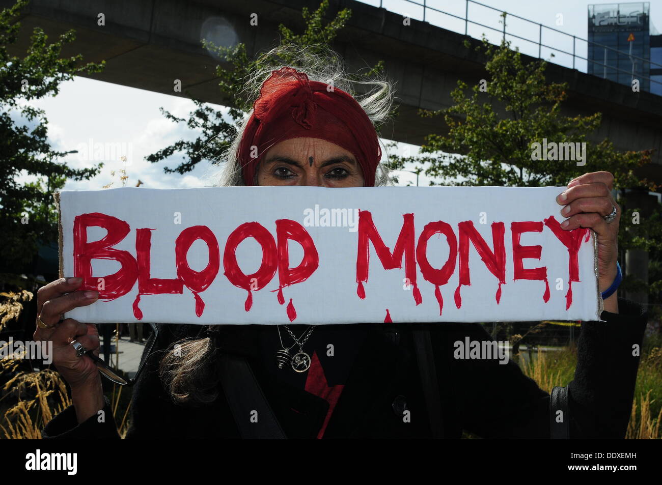 London Uk 8th Sep 2013 A Protester Holding A Placard Written - a protester holding a placard written blood money protest against desi arms sale held in excel london credit see li alamy live news