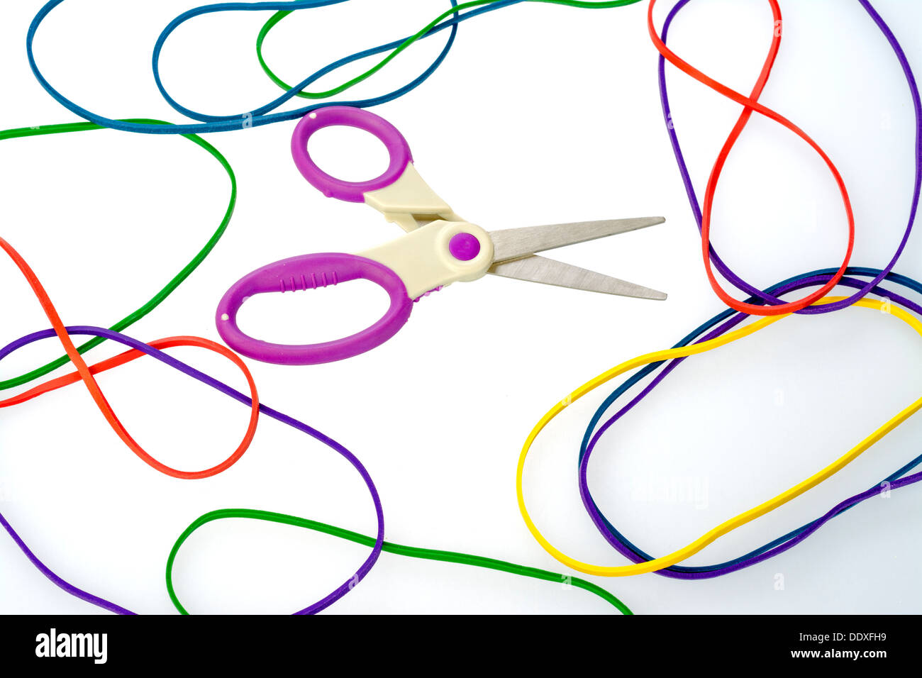 Colorful rubber bands and a pair of scissors Stock Photo Alamy