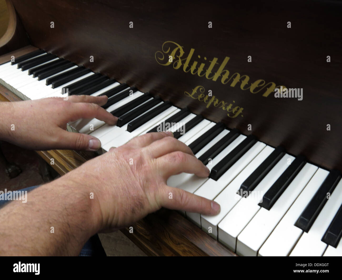 Playing a Bluthner Piano,Liepzig,Germany Stock Photo