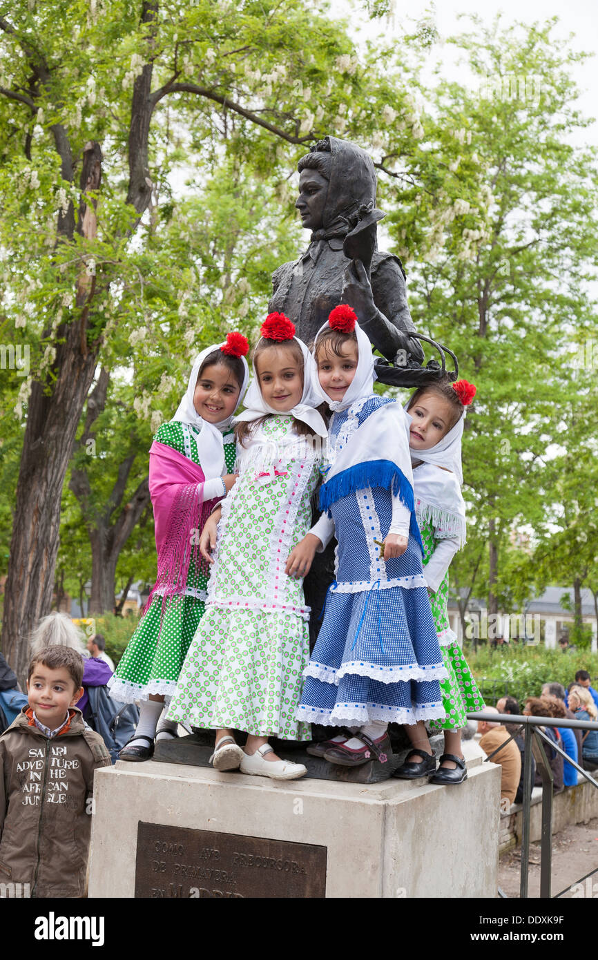 Girls dressed as chulapas pose at the San Isidro Festival in Las Vistillas Park Stock Photo