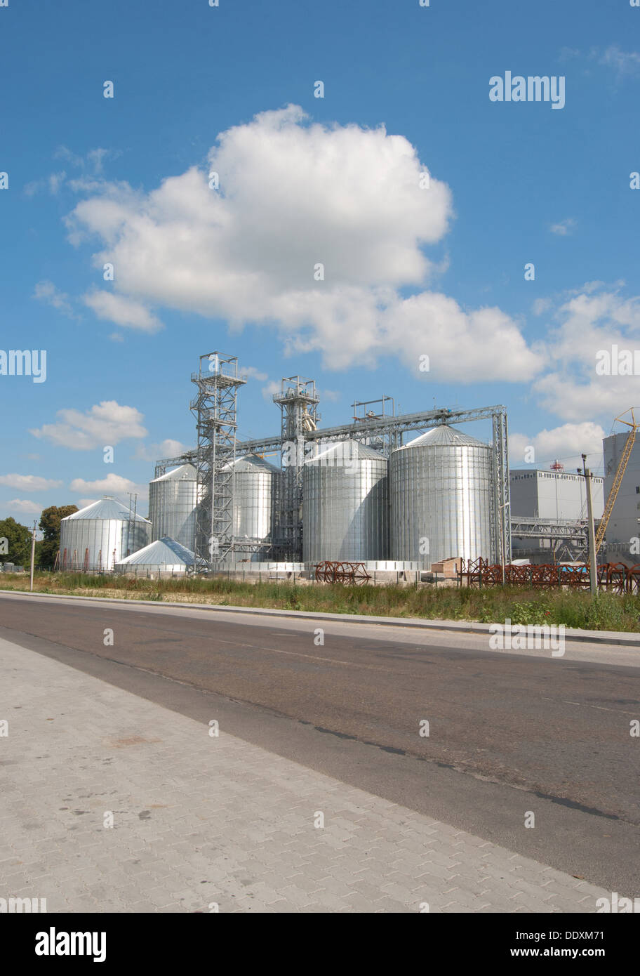 new factory is from processing of sunflower on background sky Stock Photo