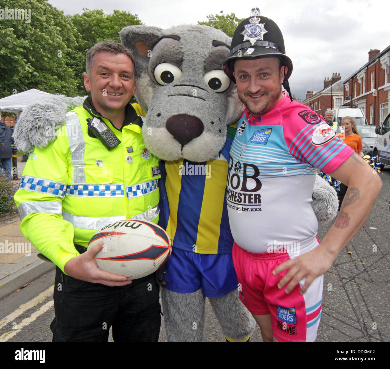 Policeman, Wolves wolfie and Canalsider at Warrington Pride September 2013 Cheshire England UK WA1 Stock Photo