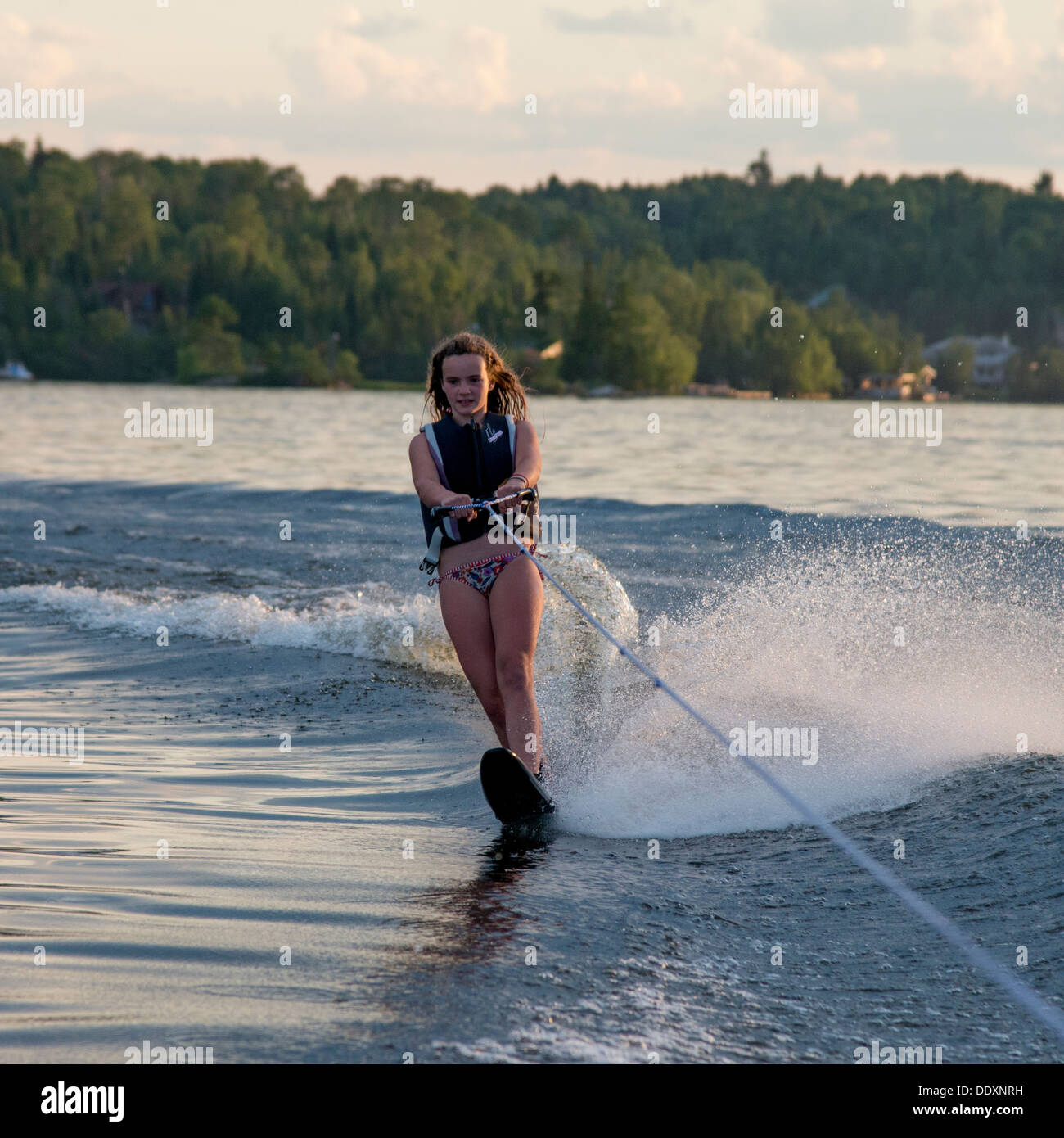 Girl water skiing in a lake, Lake of The Woods, Keewatin, Ontario