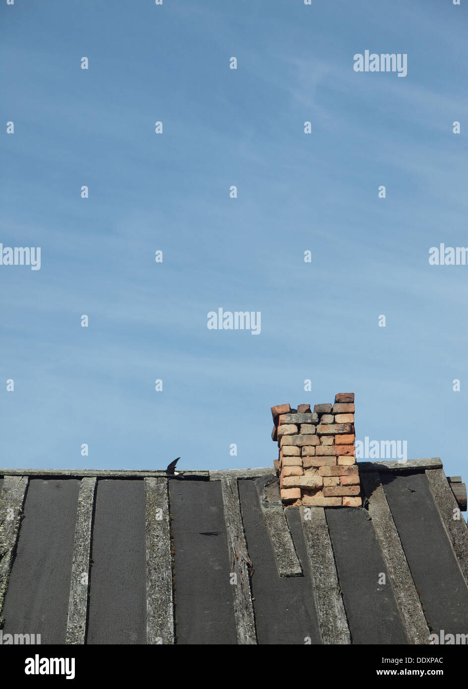 Brick chimney and roof on a background of the blue sky Stock Photo - Alamy