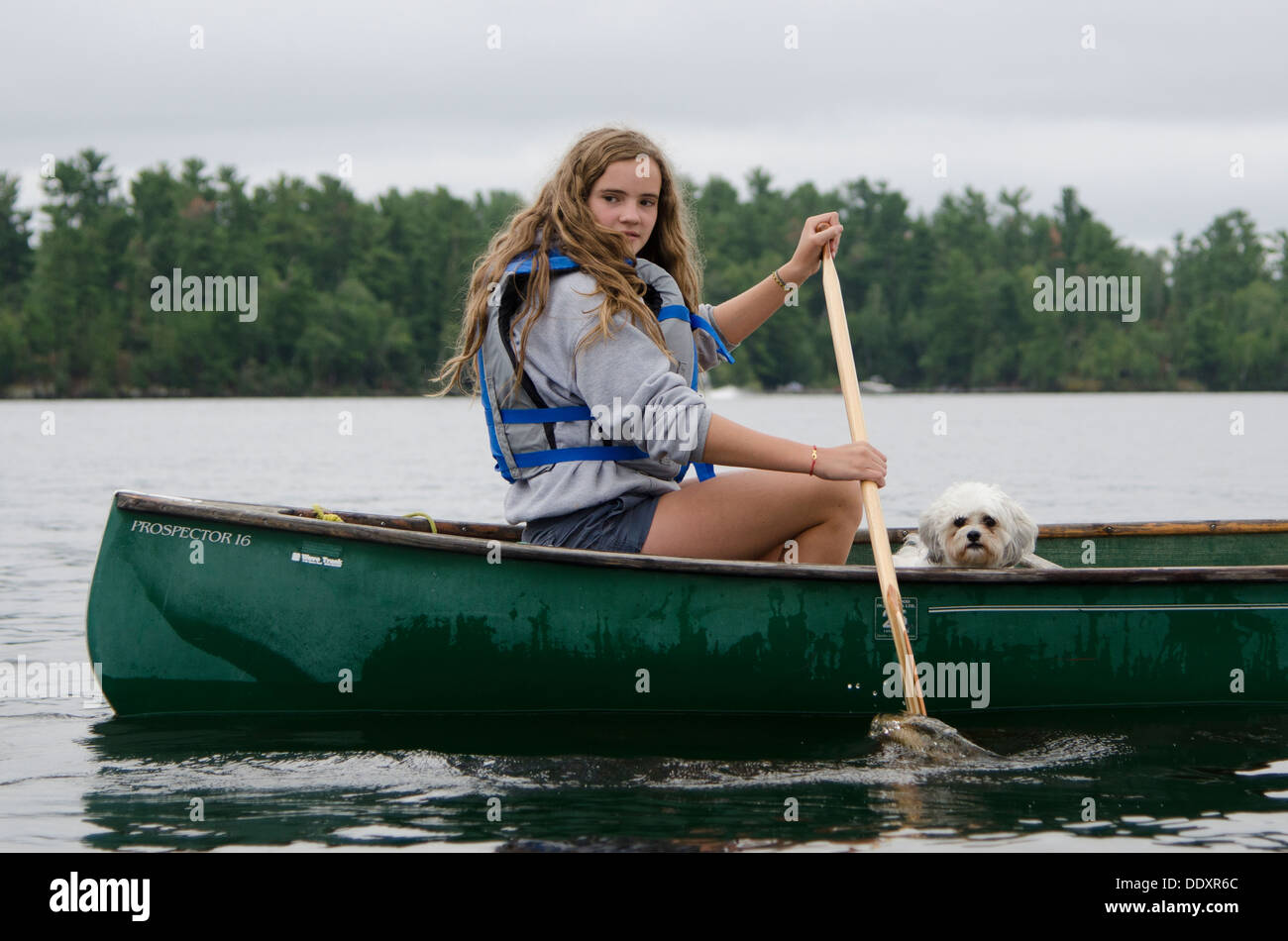 Girl boating in a lake, Lake of The Woods, Keewatin, Ontario, Canada