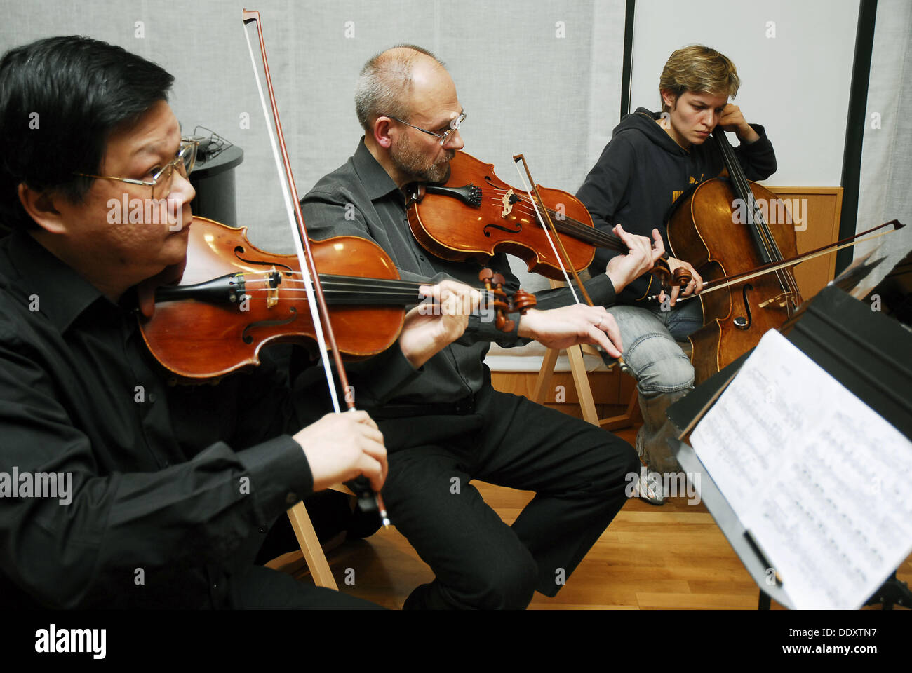 Musicians playing violin, viola and cello. Madrid, Spain Stock Photo