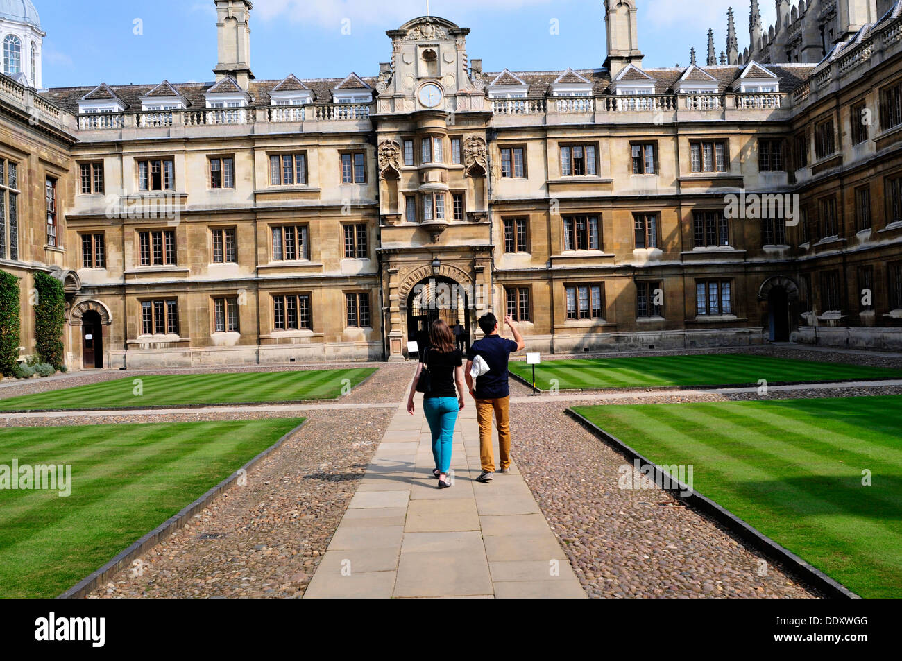 A couple walking in Clare College, Cambridge, UK Stock Photo