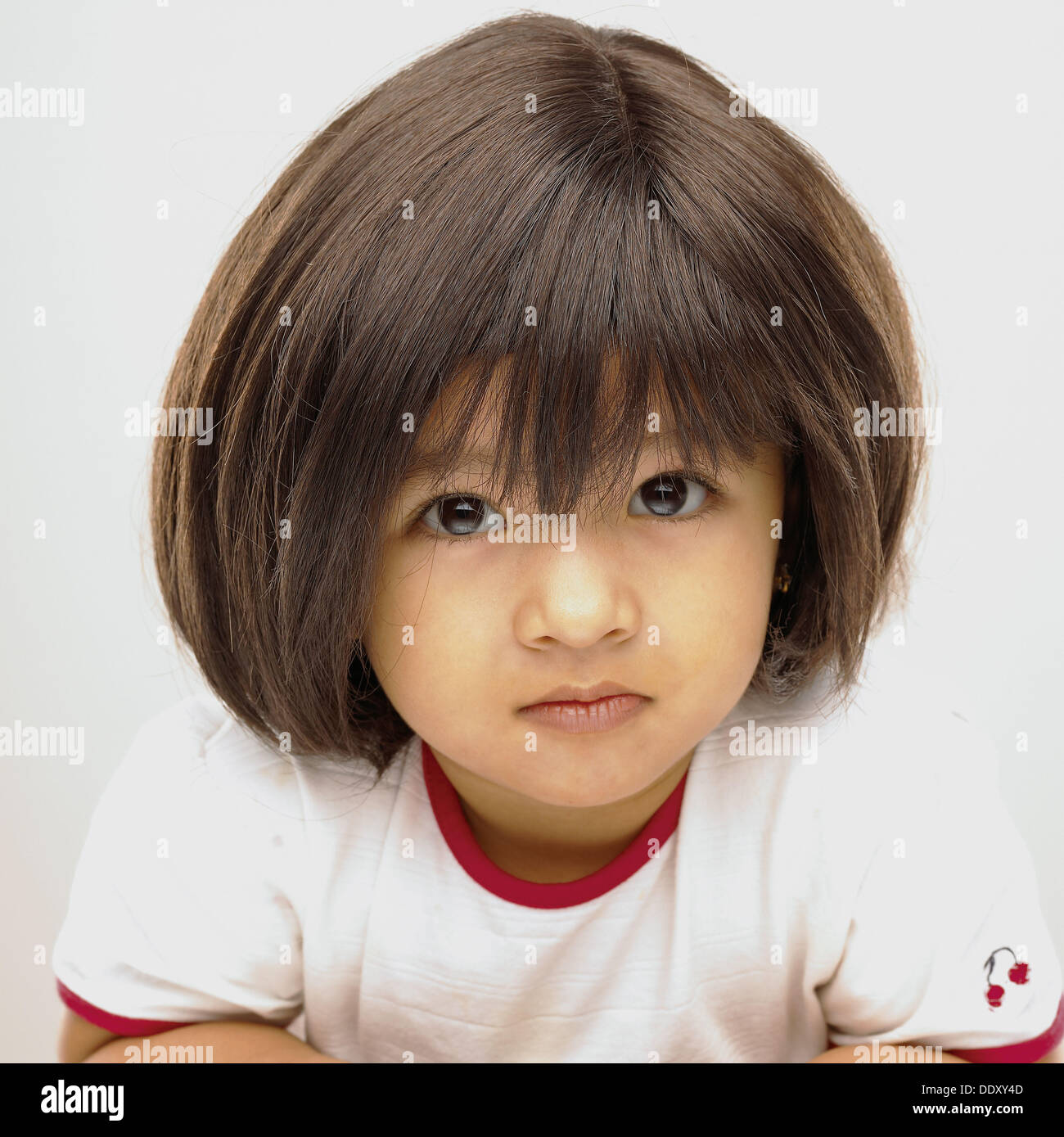 Indian baby girl 3 years wearing a wig Stock Photo - Alamy