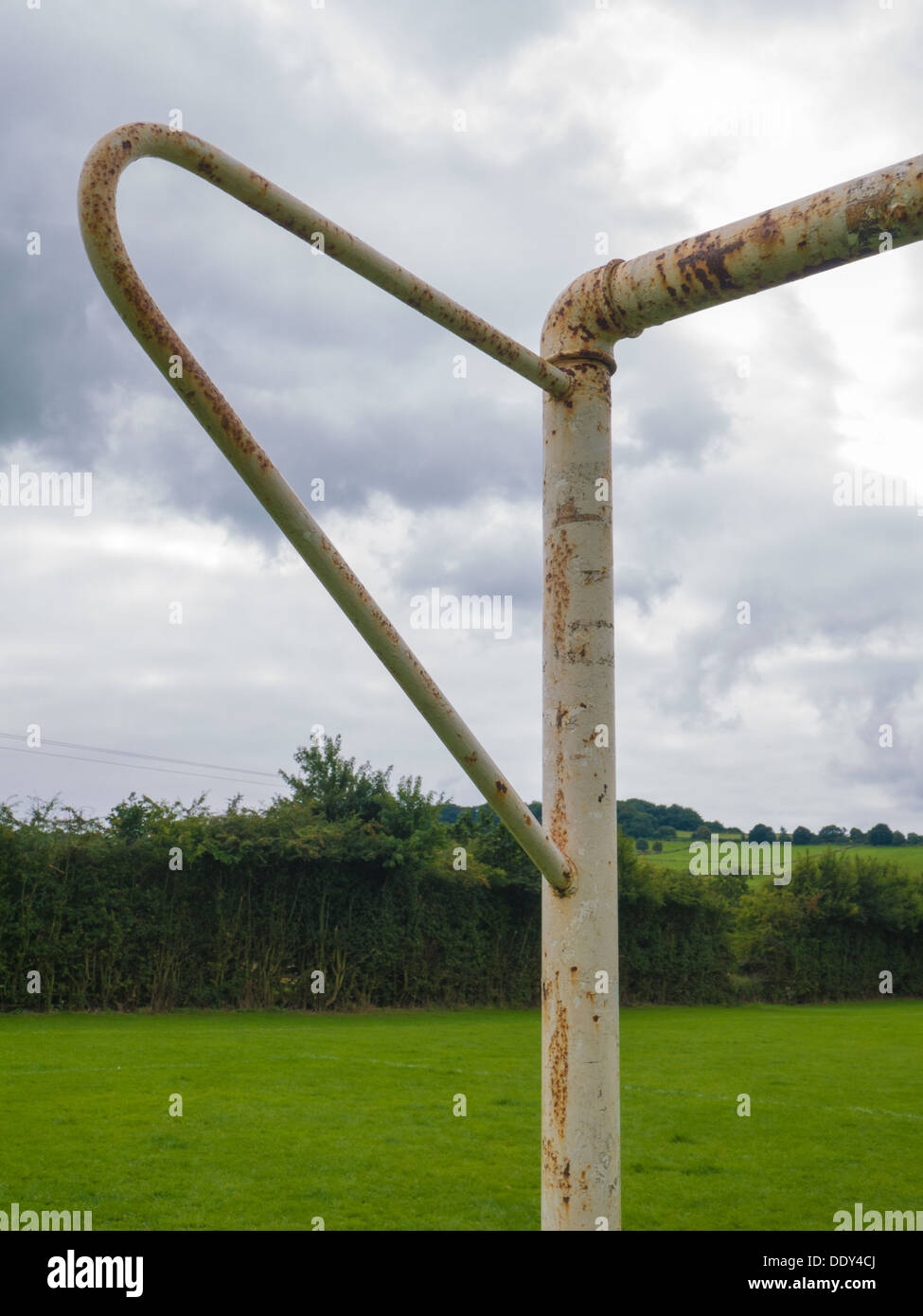 Corner of  rusty metal goal post in a public football pitch in Belper, Derbyshire, United Kingdom, UK Stock Photo