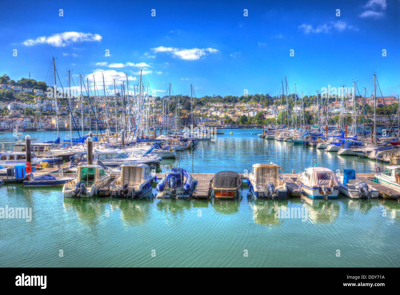 Dartmouth harbour Devon with boats and yachts on the River Dart with brilliant blue sky and sea in HDR Stock Photo