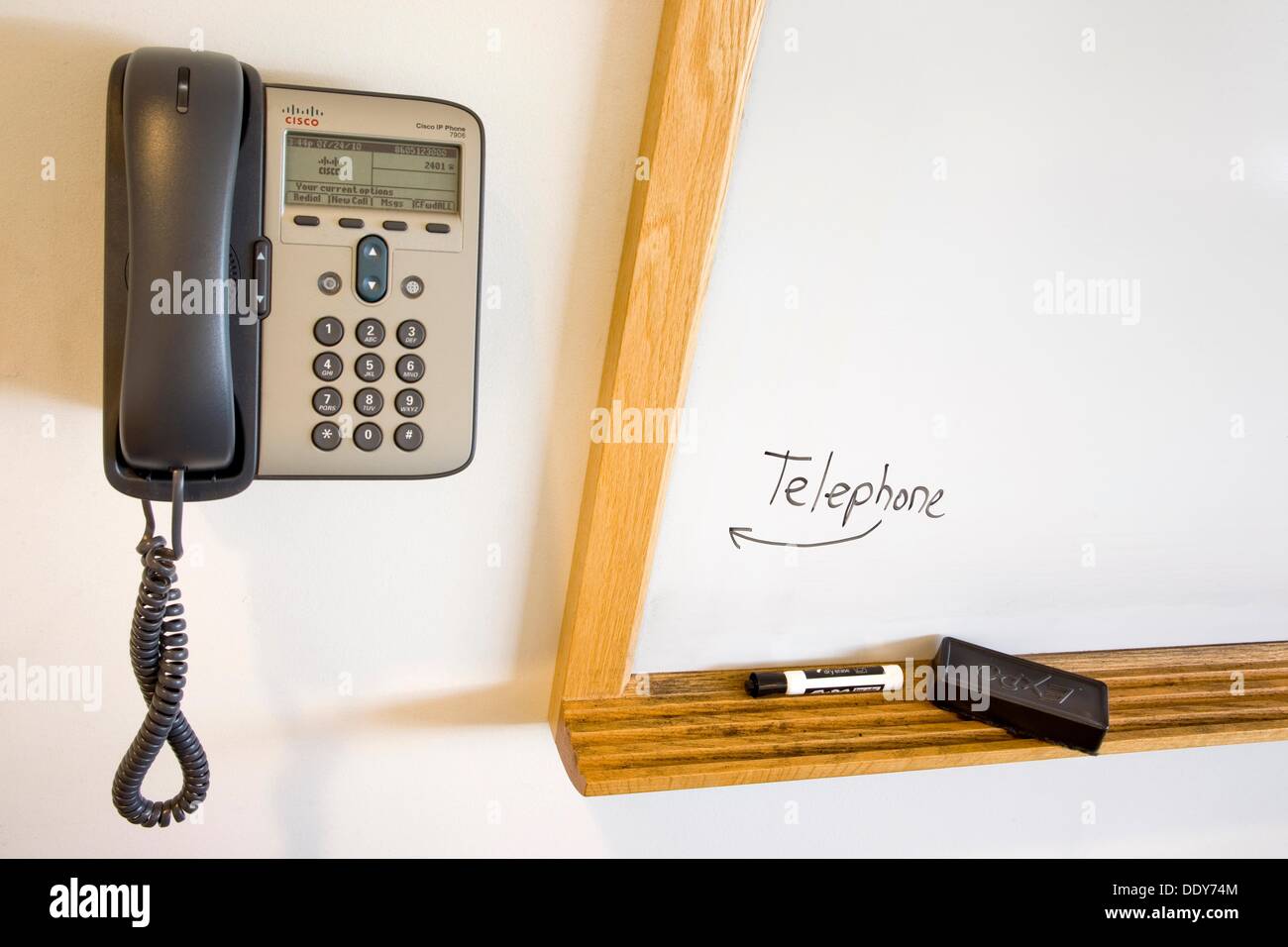 Telephone next to the word ´telephone´ in a college classroom Stock