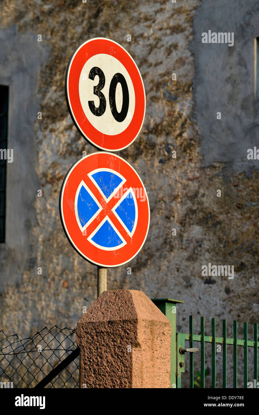 Street signs, speed limit and absolutely no stopping Stock Photo