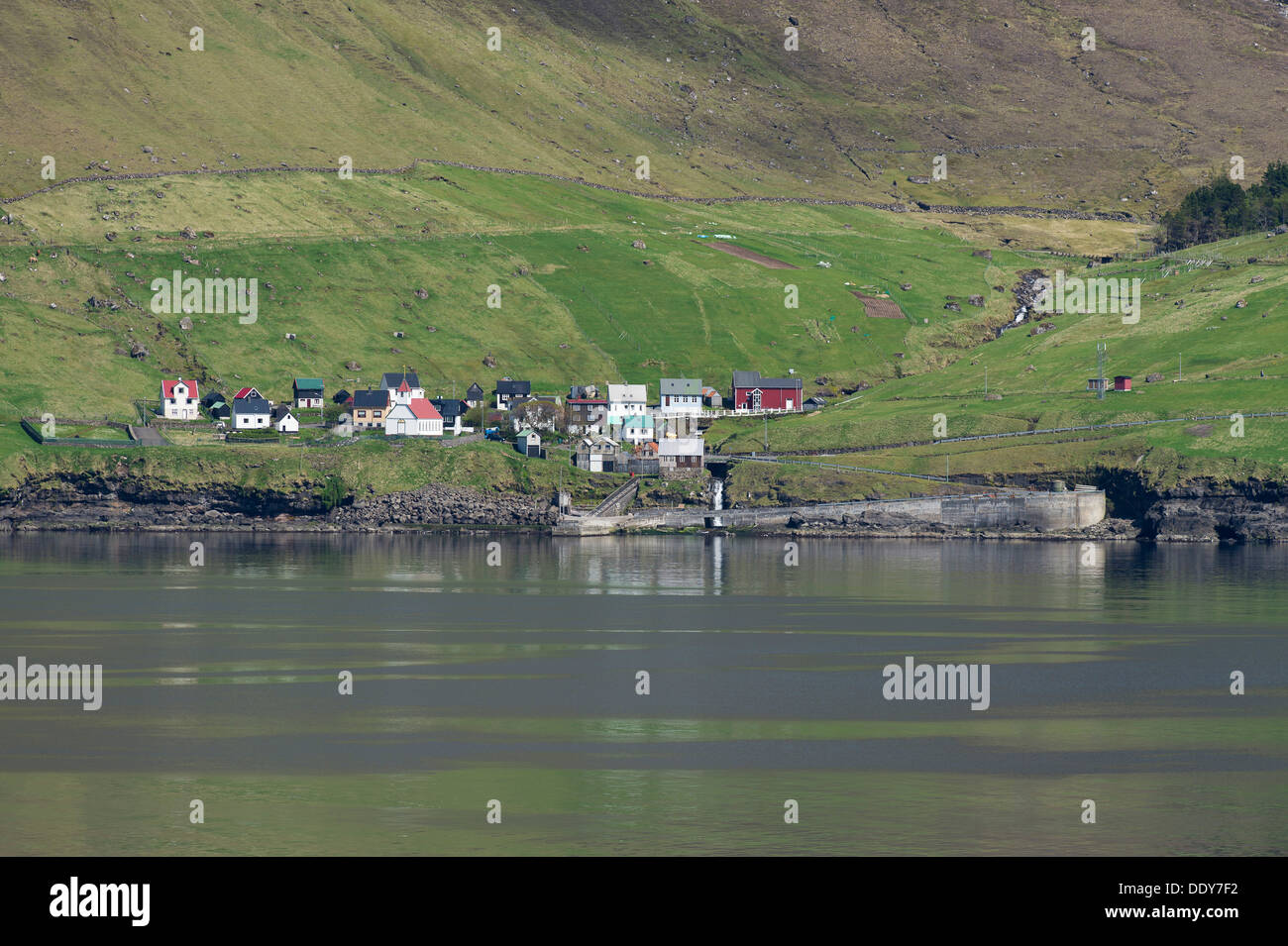Kunoy village by the sea, surrounded by fields Stock Photo