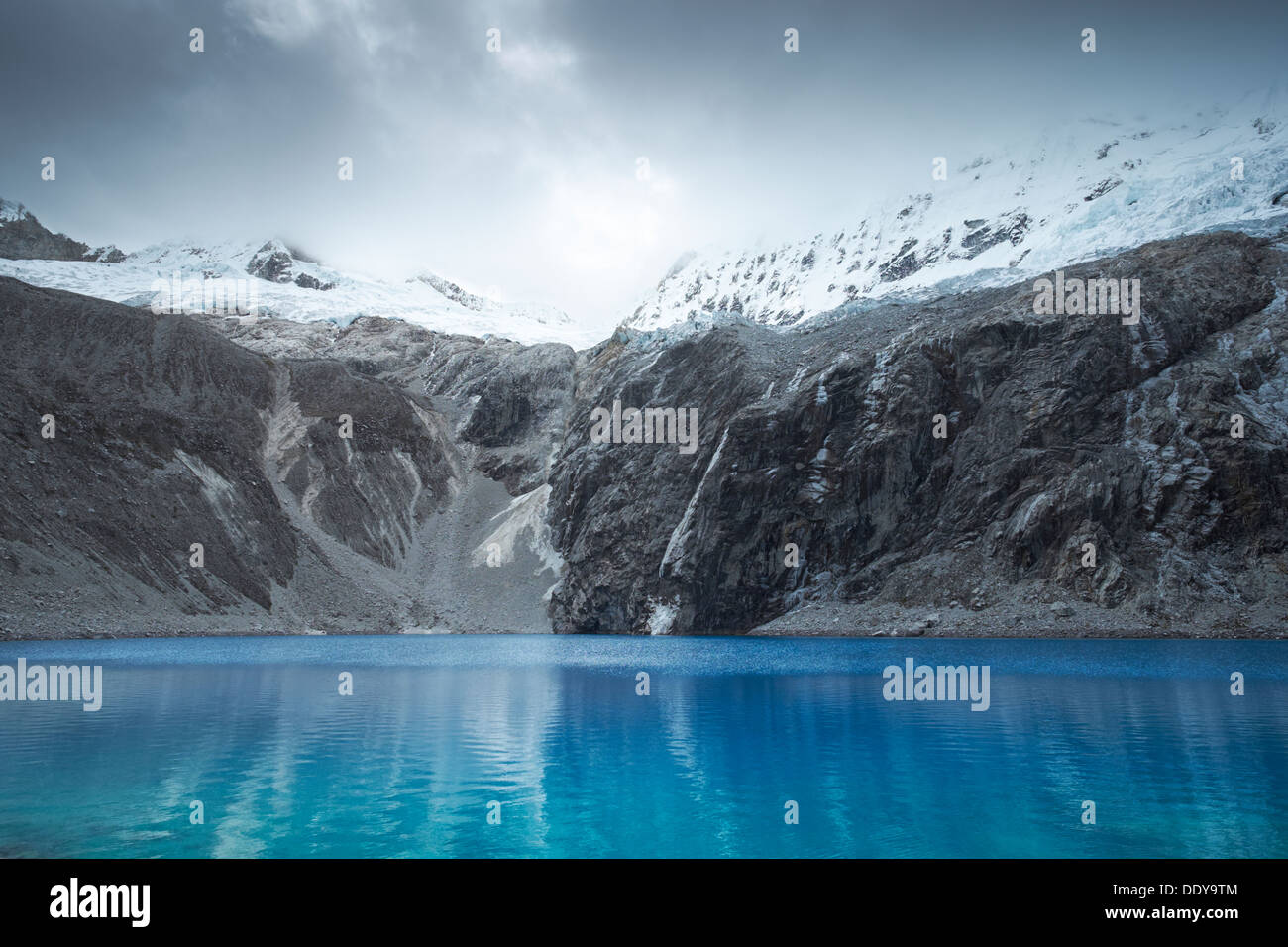 Laguna 69 with Pisco high above in the Huascarán National Park, Peruvian Andes. Stock Photo