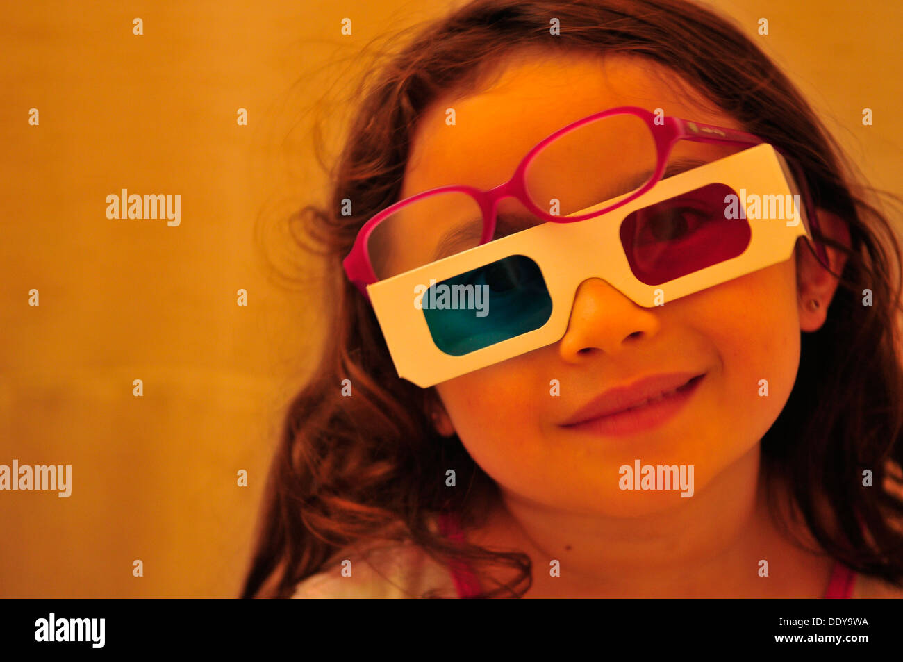 Girl wearing 3D glasses Stock Photo