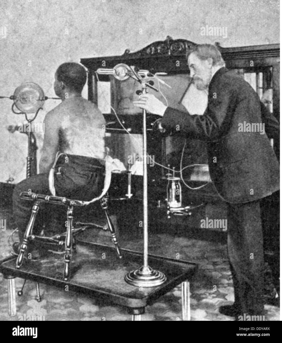 medicine, irradiation / X-ray / measurement, Afro-American getting treatment with X-rays to bleach the skin, USA, circa 1910, Additional-Rights-Clearences-Not Available Stock Photo