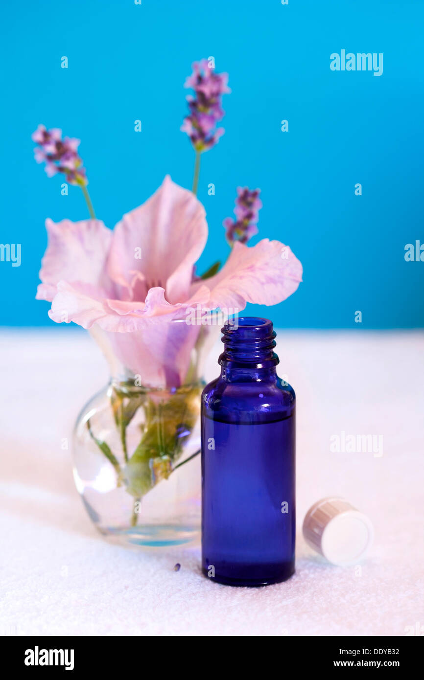 Aromatherapy oil, lavender, flower, towel Stock Photo