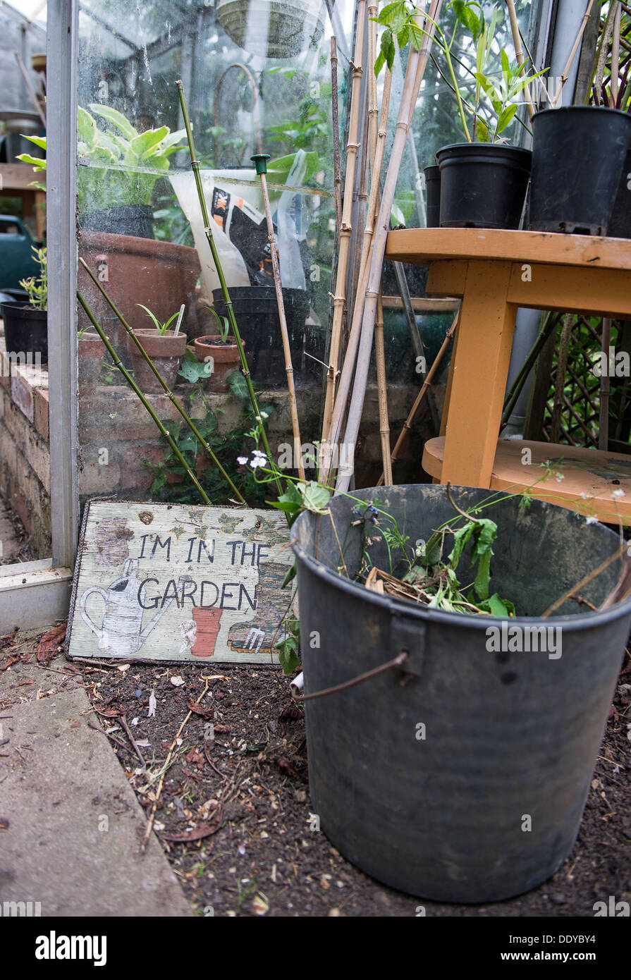 Garden stuff next to the greenhouse Stock Photo