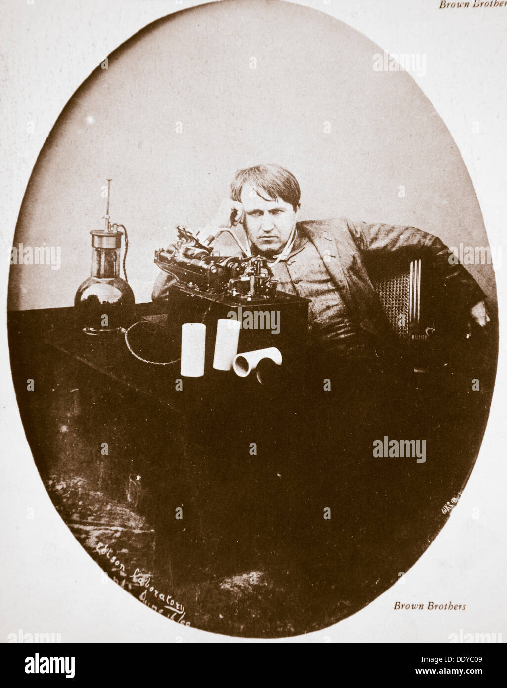 Thomas Alva Edison, American inventor, sitting beside his improved machine, 1889. Artist: Unknown Stock Photo