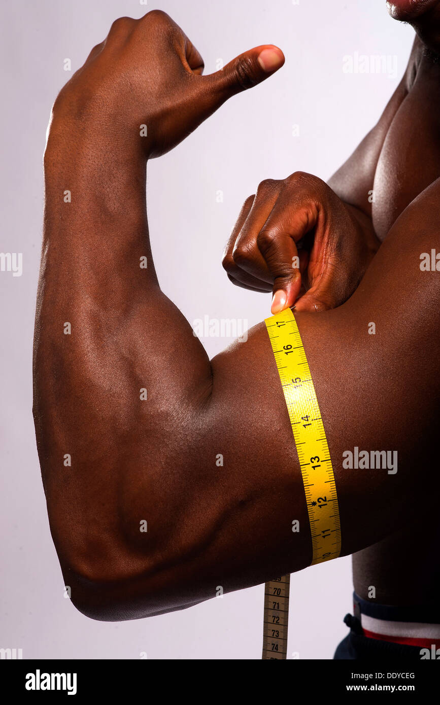 Man Measuring His Biceps With Measuring Tape On White Background Stock  Photo - Alamy