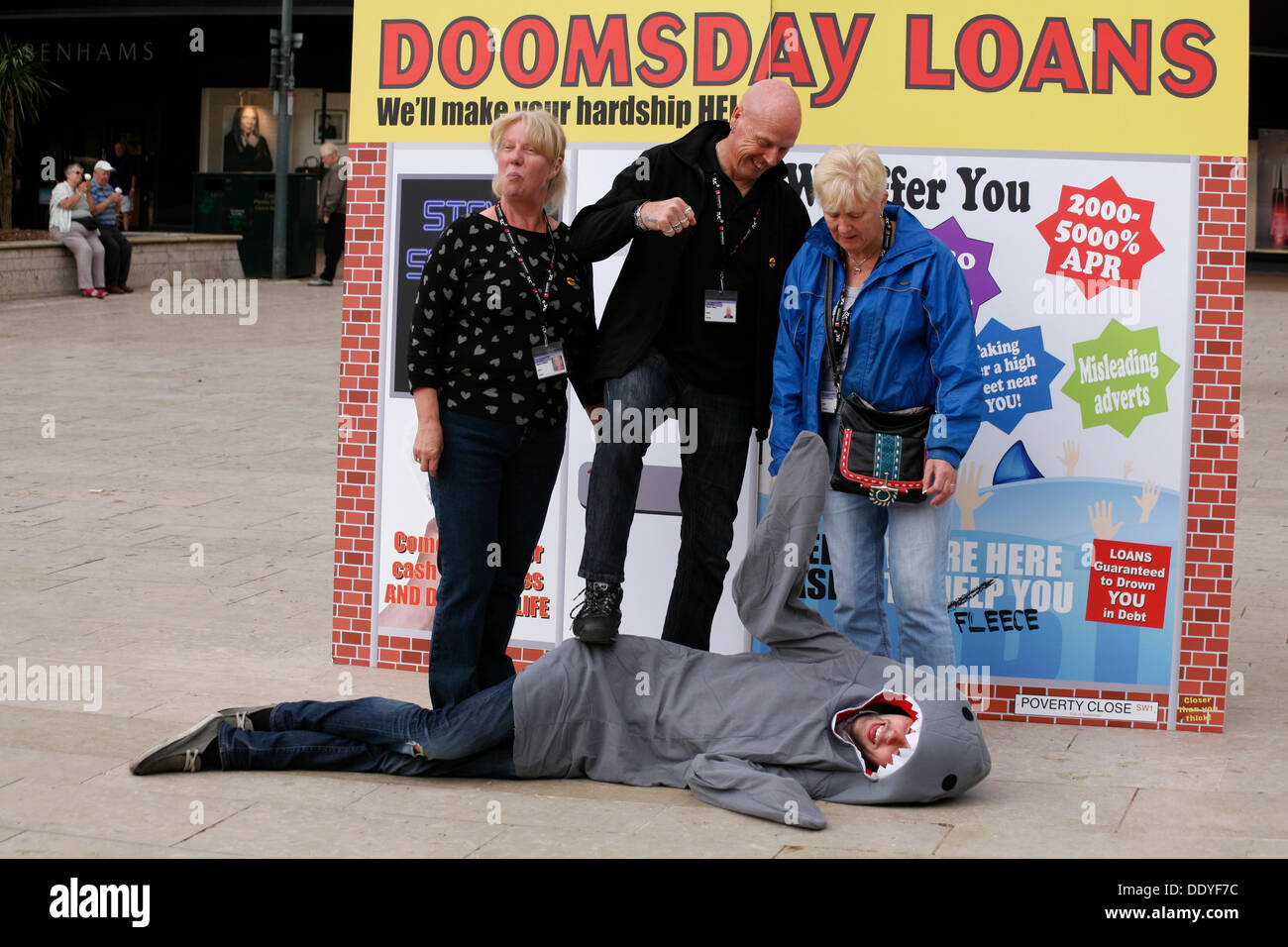 Bournemouth, UK 9 September 2013. A 'pop up doomsday payday loan shop' is set up in Bournemouth Square to coincide with latest Unite figures on the amount people are borrowing to get through the month; reportedly a new survey reveals the amount of money that hard pressed Unite members have to borrow each month to make ends meet has tripled since 2012 to £660. Credit:  Carolyn Jenkins/Alamy Live News Stock Photo