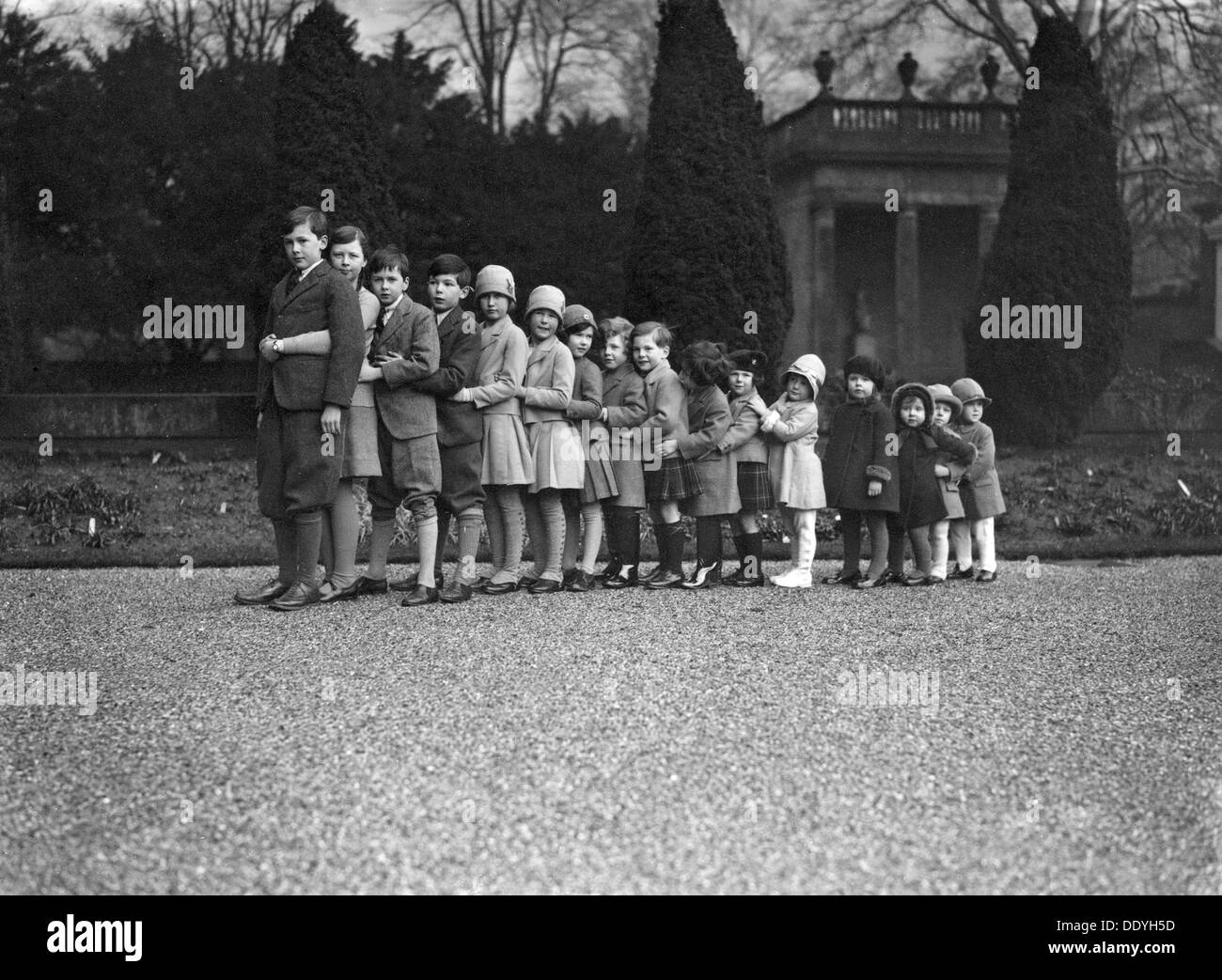Cavendish family group of 16 grandchildren in the gardens of Chatsworth, Derbyshire, Christmas 1929. Artist: JR Board Stock Photo