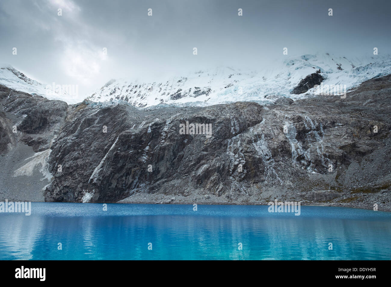 Laguna 69 with Pisco high above in the Huascarán National Park, Peruvian Andes. Stock Photo