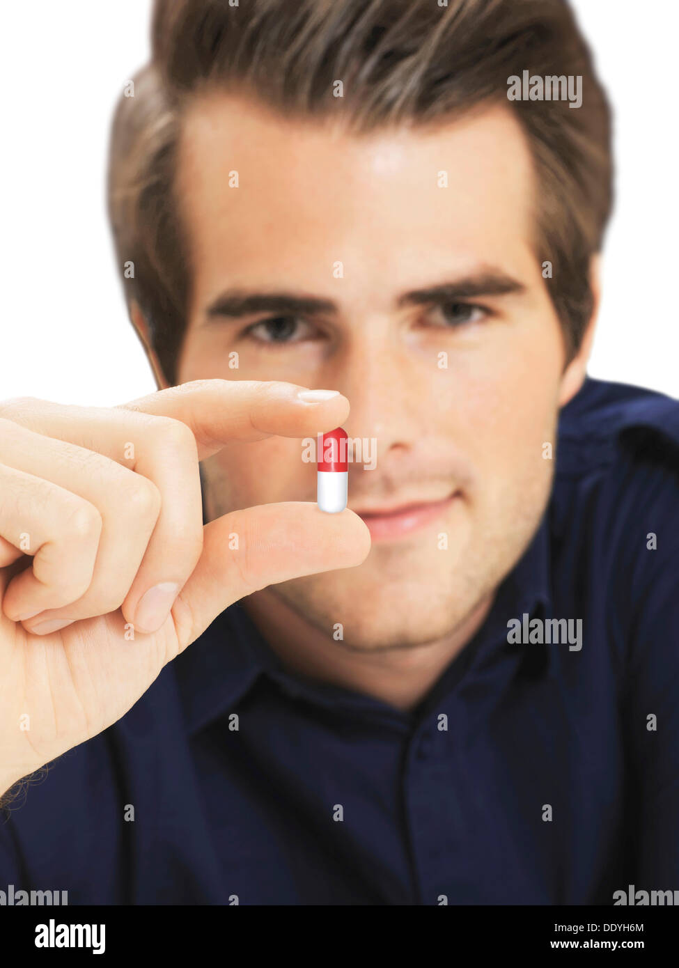 Businessman holding capsule Stock Photo Alamy
