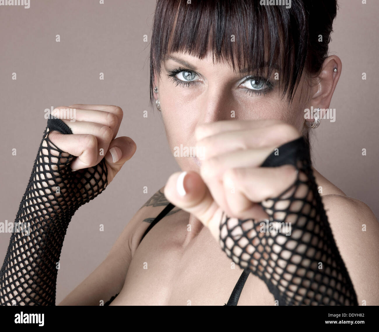 Woman, Gothic, dark-haired, balling her fists Stock Photo