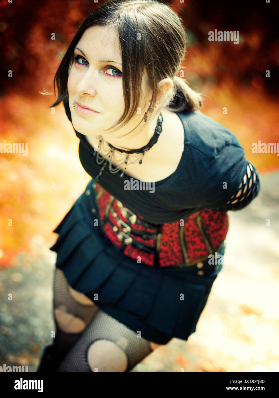 Woman, Gothic, leaning forward, outdoors, autumn Stock Photo