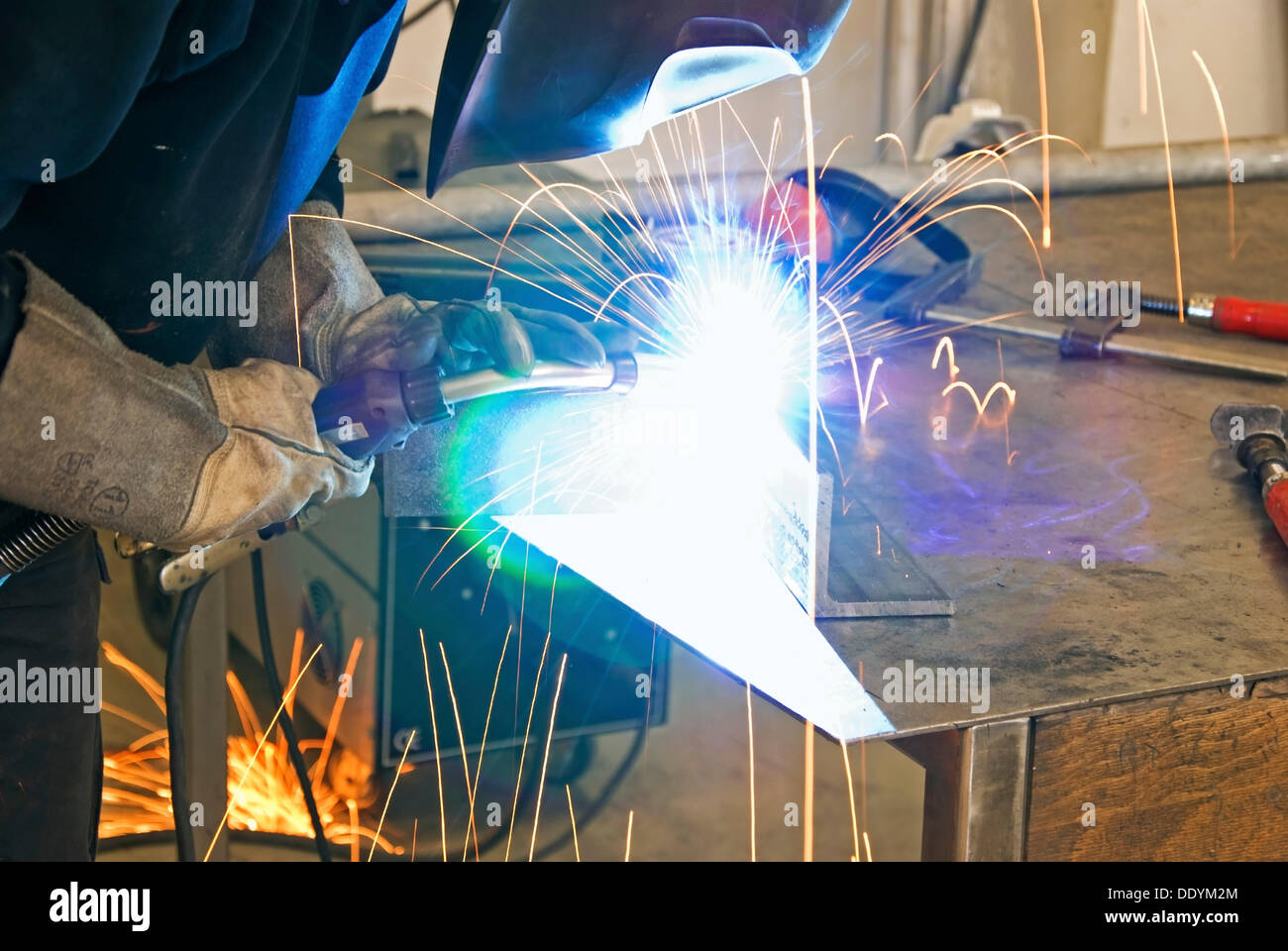 Welder in metal shop, Berlin Stock Photo