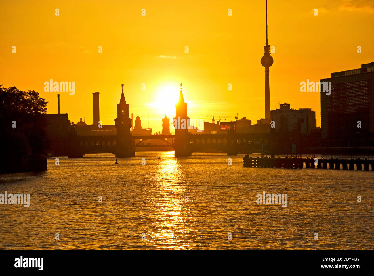 Oberbaumbruecke bridge and Spree river at sunset, Berlin Stock Photo