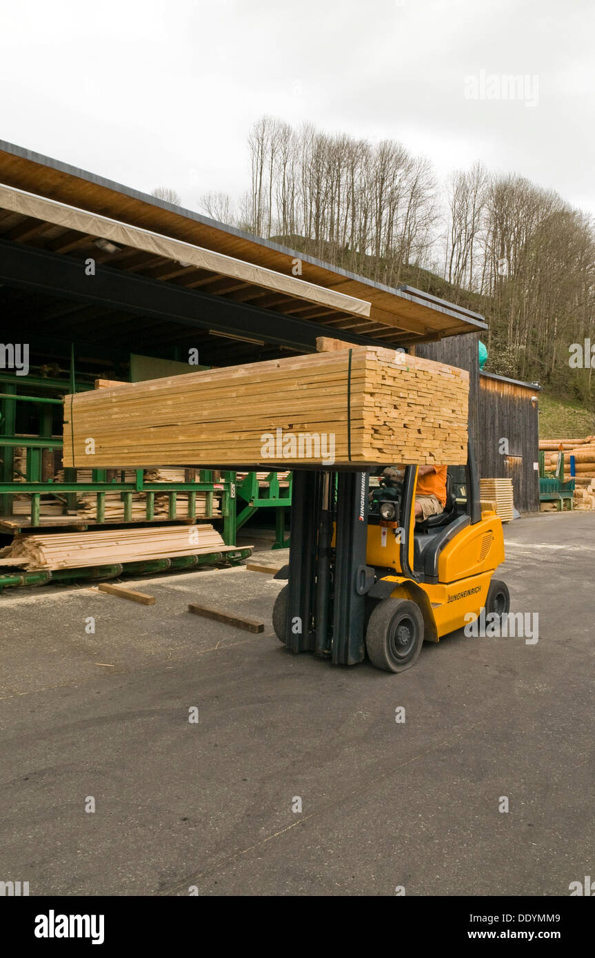 Forklift transporting high-quality lumber, sawmill, timber trade Stock