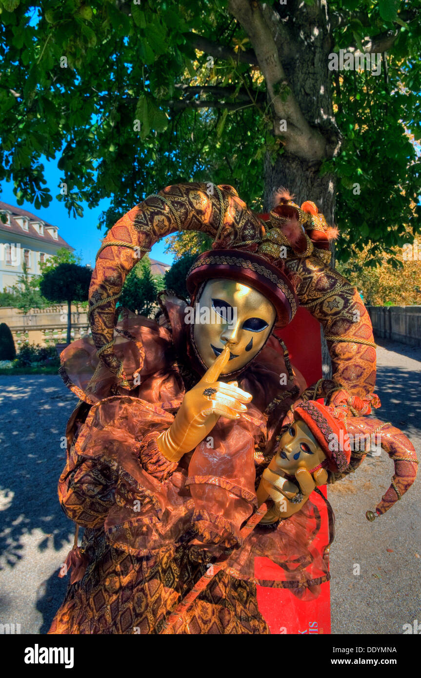 Performer wearing a Harlequin mask and a costume, Venezianische Messe, Venetian festival, Ludwigsburg, Baden-Wuerttemberg Stock Photo