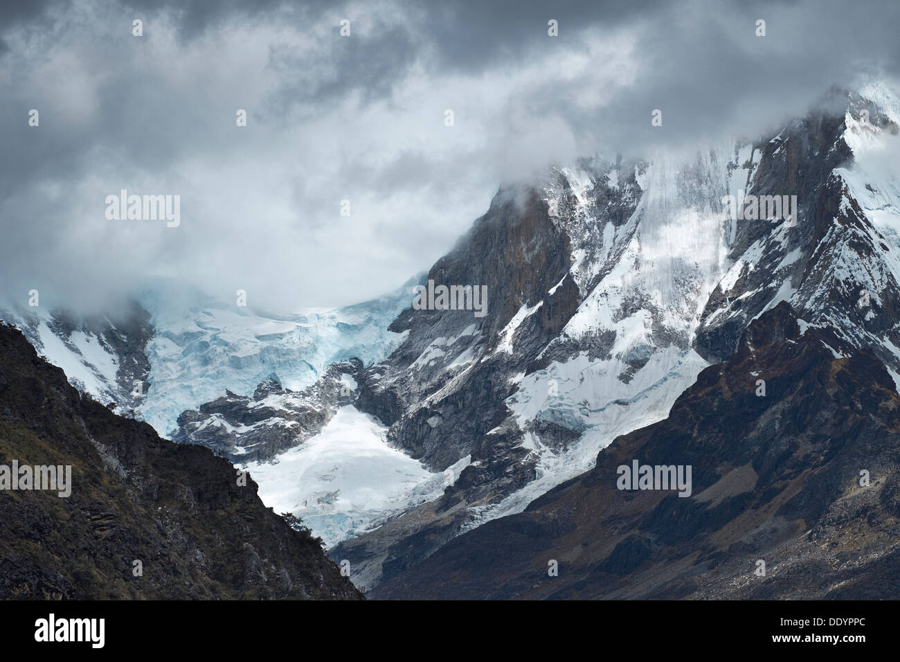 Storm Clouds over the summit of Huascaran in the Huascarán National Park, Peruvian Andes. Stock Photo