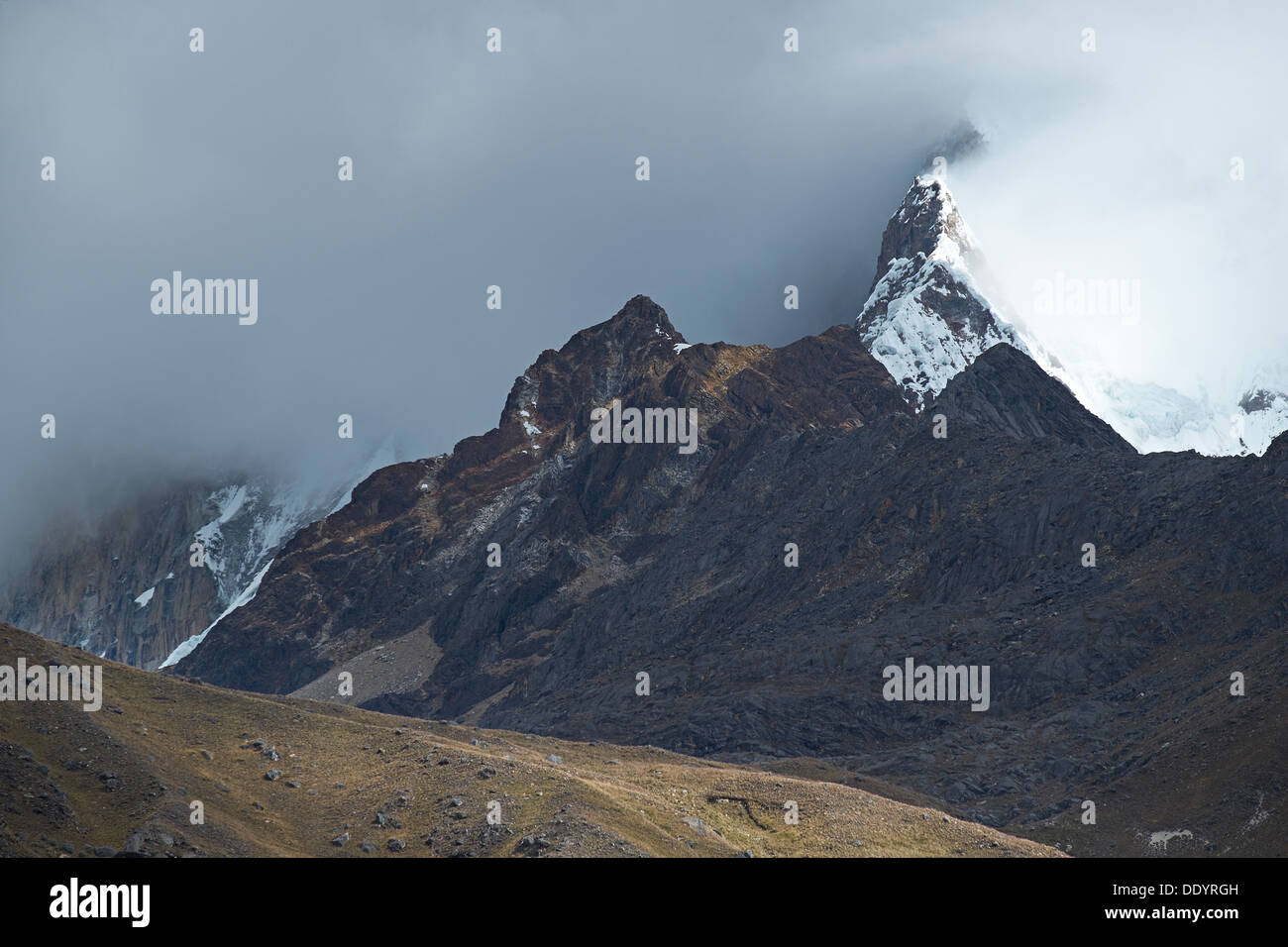 Storm Clouds over the summit of Huascaran in the Huascarán National Park, Peruvian Andes. Stock Photo
