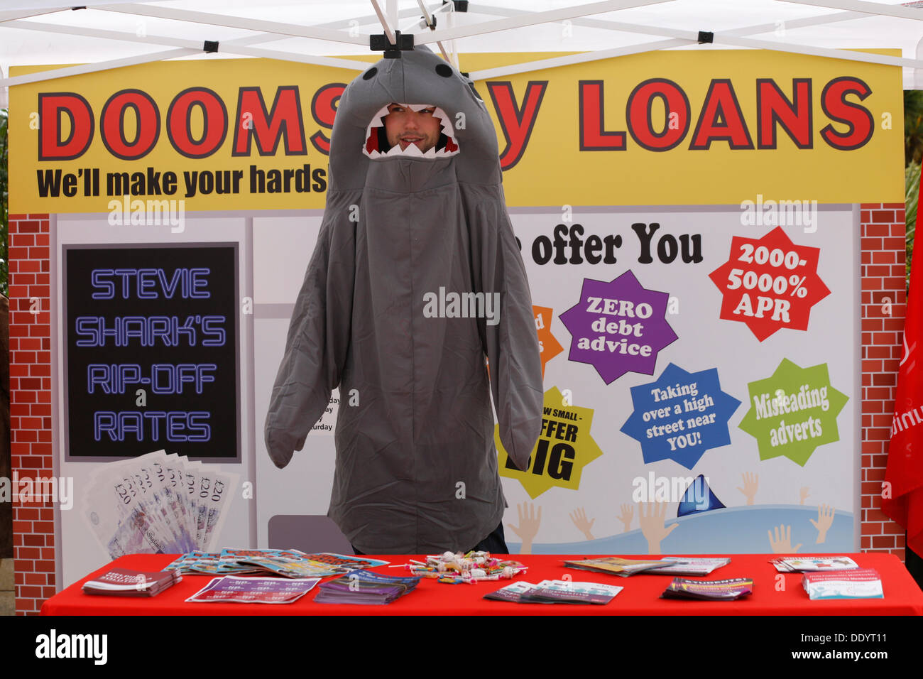 Bournemouth, UK 9 September 2013. A 'pop up doomsday payday loan shop' is set up in Bournemouth Square to coincide with latest Unite figures on the amount people are borrowing to get through the month; reportedly a new survey reveals the amount of money that hard pressed Unite members have to borrow each month to make ends meet has tripled since 2012 to £660. Credit:  Carolyn Jenkins/Alamy Live News Stock Photo