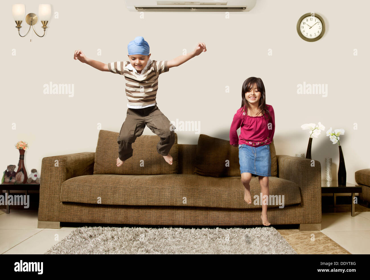 Playful little kids having fun playing at home Stock Photo