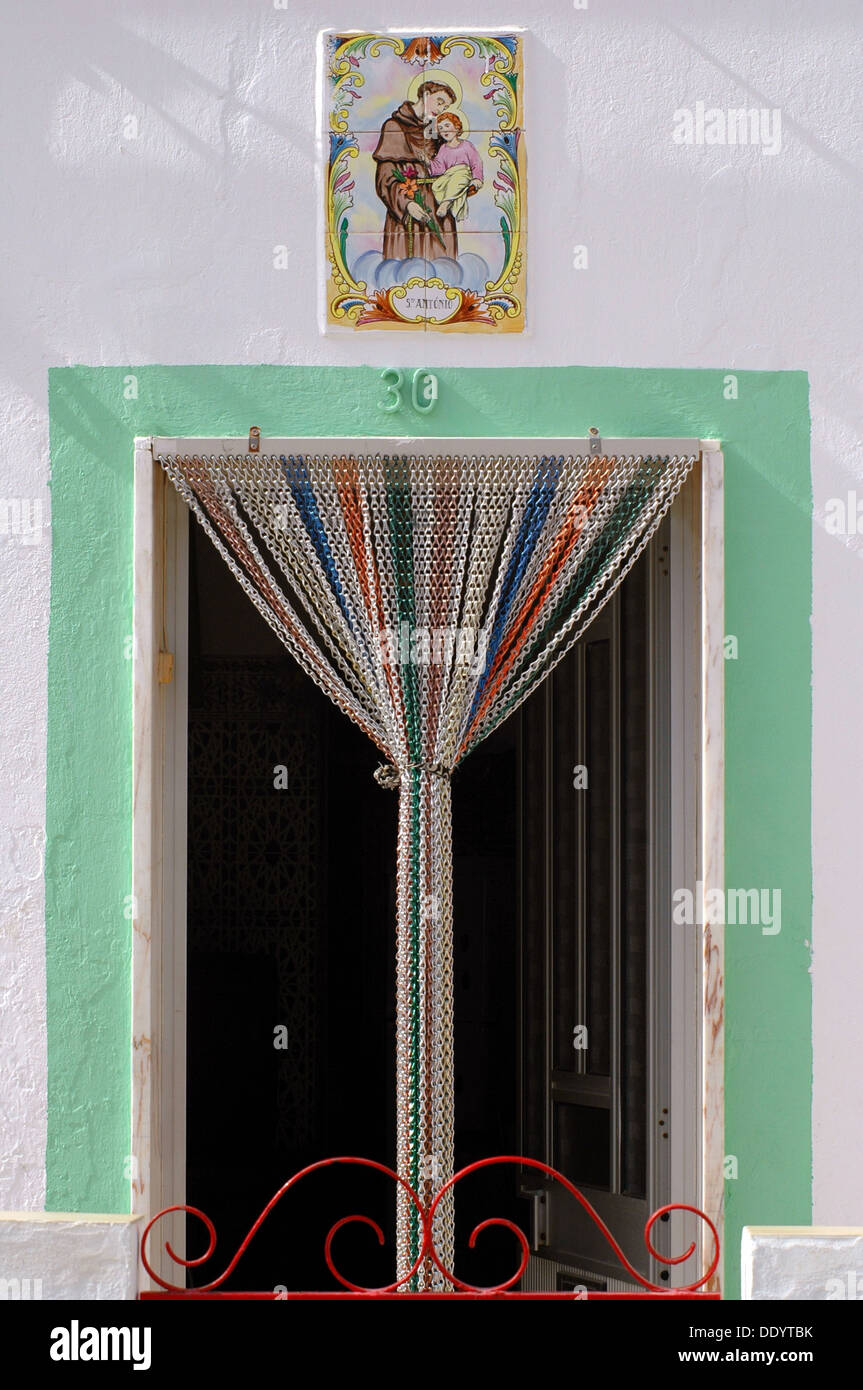 A Doorway With Wooden Beaded Curtain Made Out Of Bamboo With