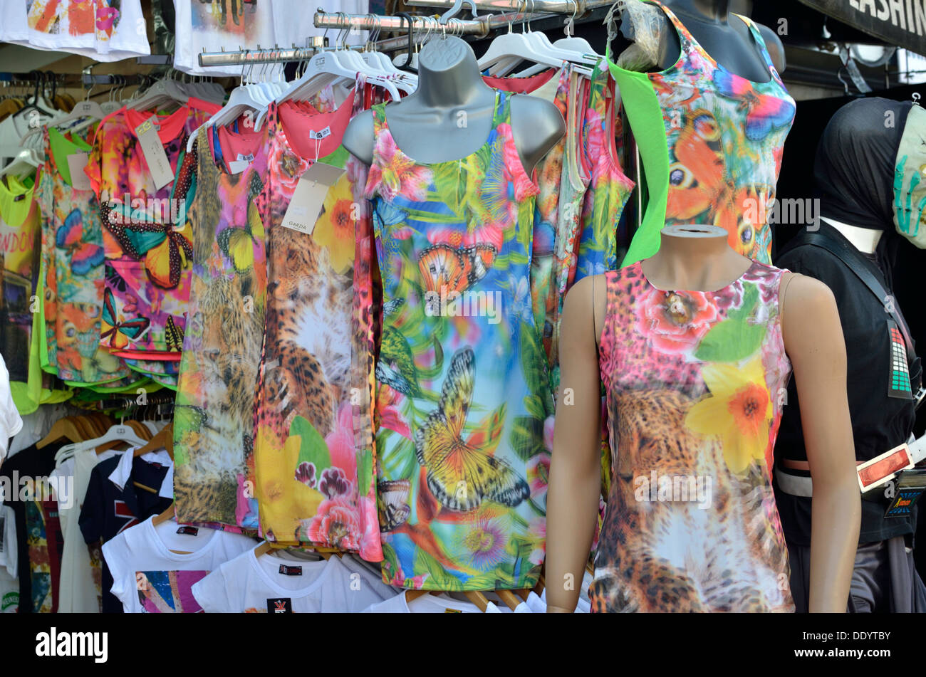 Bright colourful dresses on a market stall, Camden Town, London, UK. Stock Photo