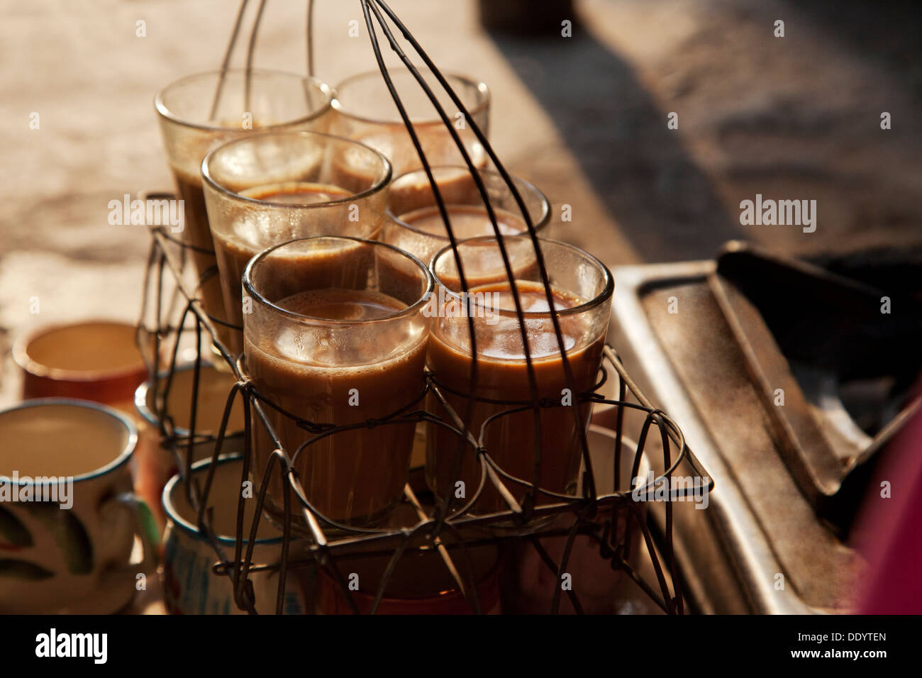 Close-up of fresh traditional Indian chai kept in grid tray Stock Photo