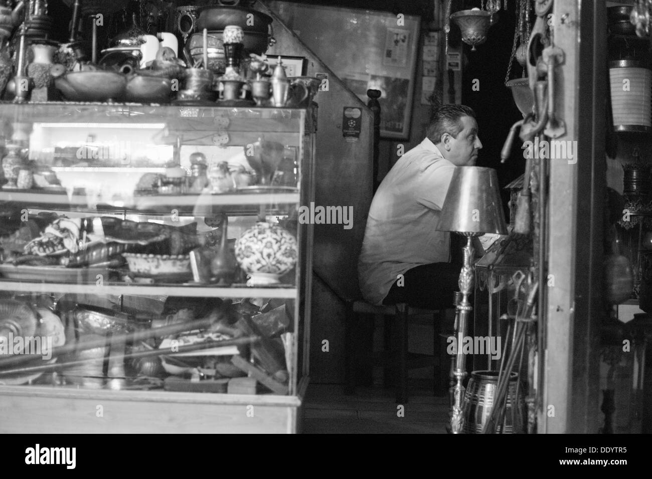 Turkish Shopkeeper Shopkeeper working inside the Grand Bazaar in Istanbul Turkey Stock ...