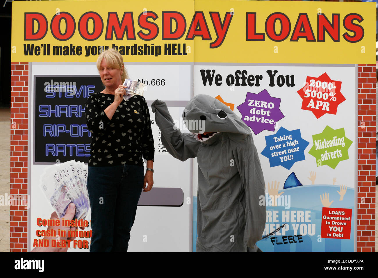 Bournemouth, UK 9 September 2013. A 'pop up doomsday payday loan shop' is set up in Bournemouth Square to coincide with latest Unite figures on the amount people are borrowing to get through the month; reportedly a new survey reveals the amount of money that hard pressed Unite members have to borrow each month to make ends meet has tripled since 2012 to £660. Stock Photo