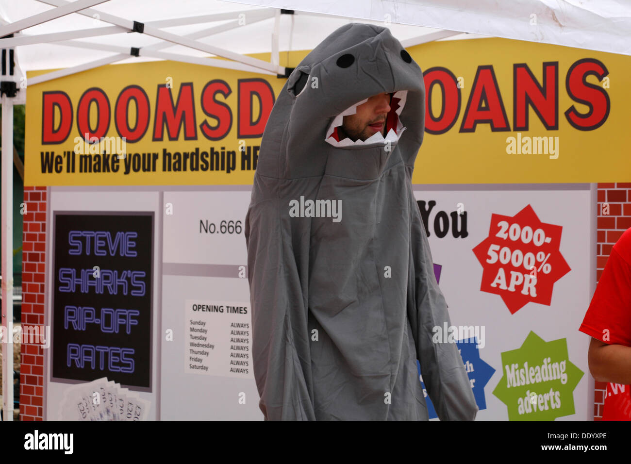 Bournemouth, UK 9 September 2013. A 'pop up doomsday payday loan shop' is set up in Bournemouth Square to coincide with latest Unite figures on the amount people are borrowing to get through the month; reportedly a new survey reveals the amount of money that hard pressed Unite members have to borrow each month to make ends meet has tripled since 2012 to £660. Stock Photo