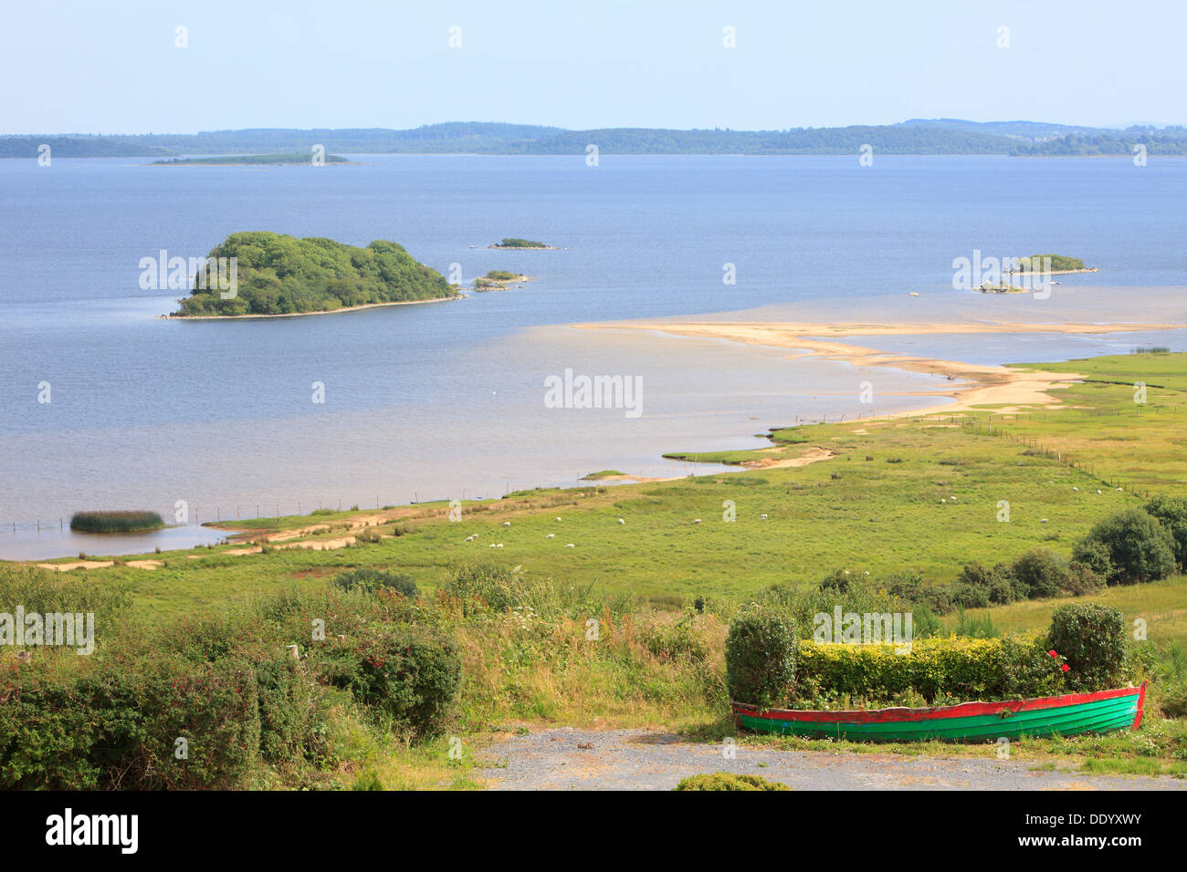 Moored colorful wooden fishing boats along Lough Mask in Tourmakeady, Ireland Stock Photo