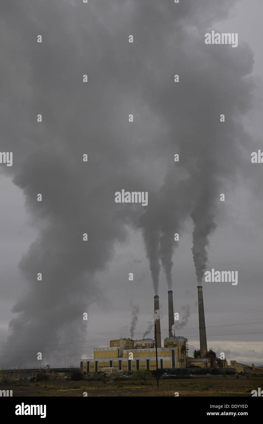 Steam and smoke coming from tall chimneys at coal burning power plant near Price, Utah Stock Photo