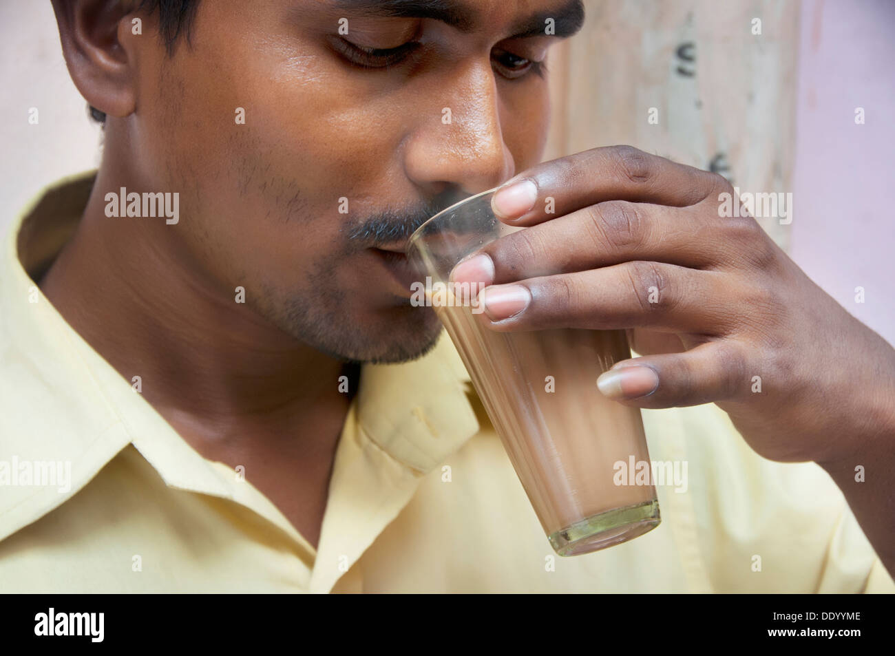 Indian mid adult man drinking morning chai Stock Photo