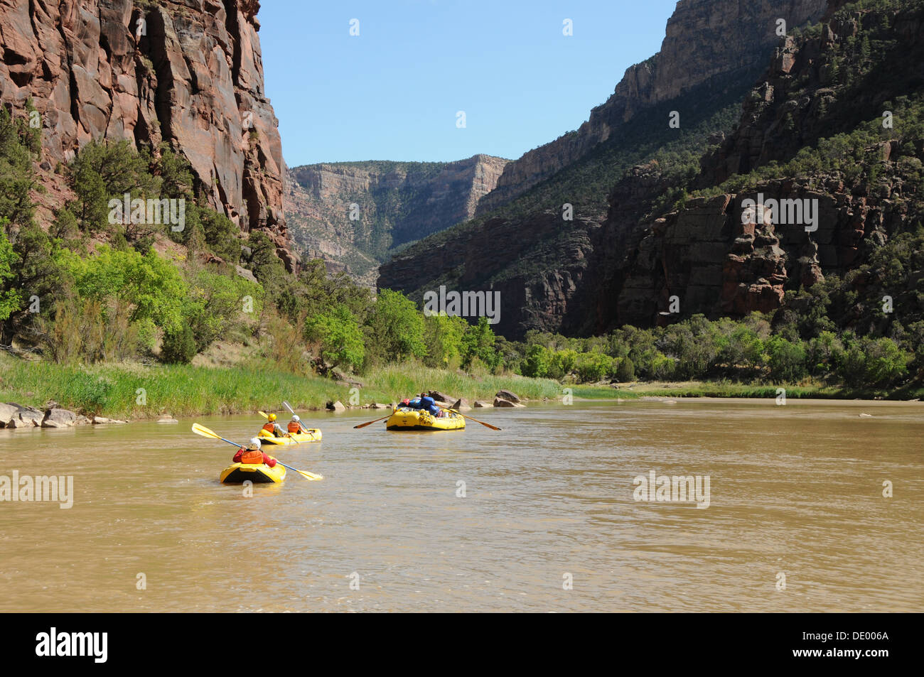 Rubber inflatable boats and kayaks  with O.A.R.S. group rafting on the Green River in Dinosaur National Monument,  Utah Stock Photo