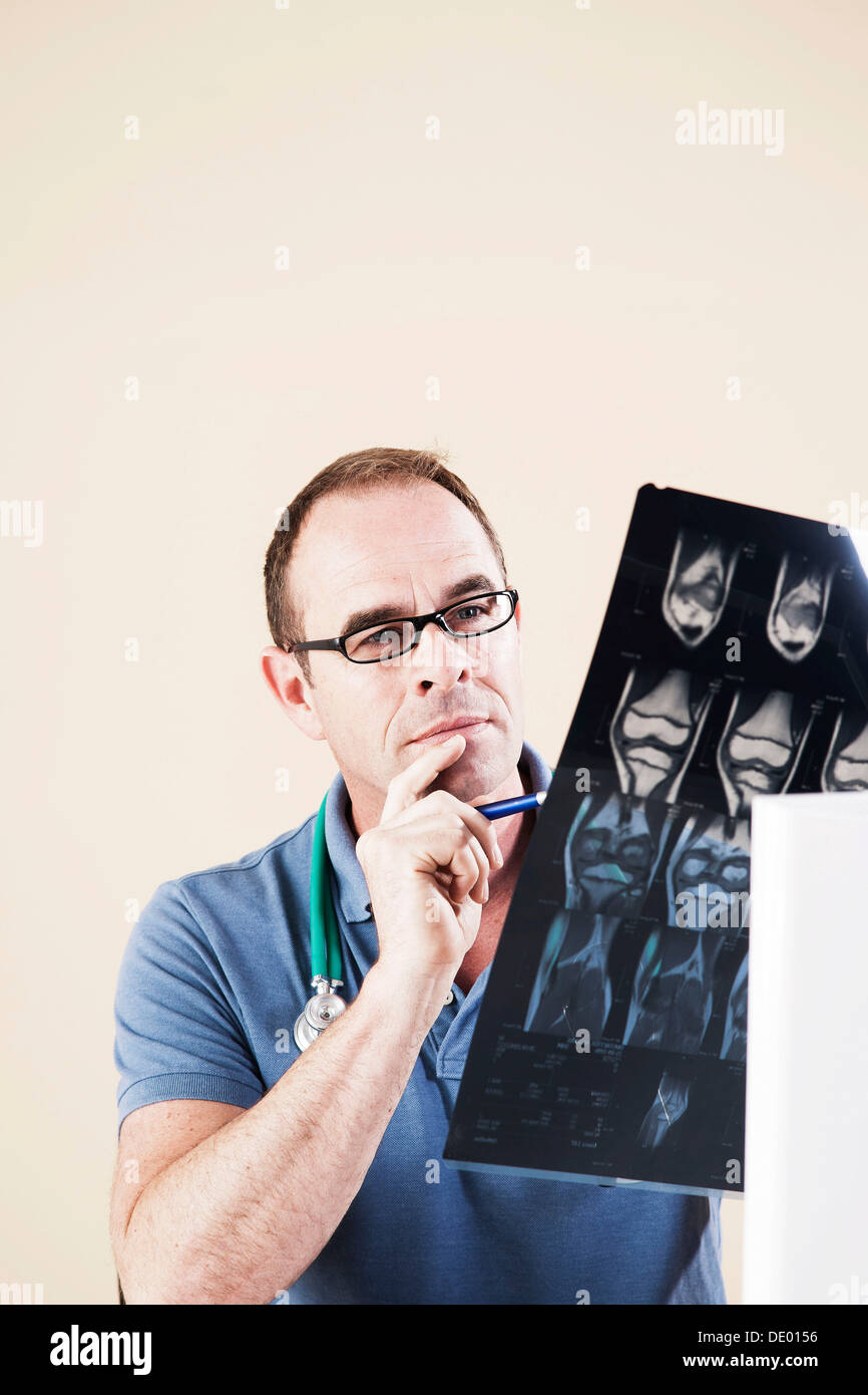 Doctor looking at an X-ray Stock Photo